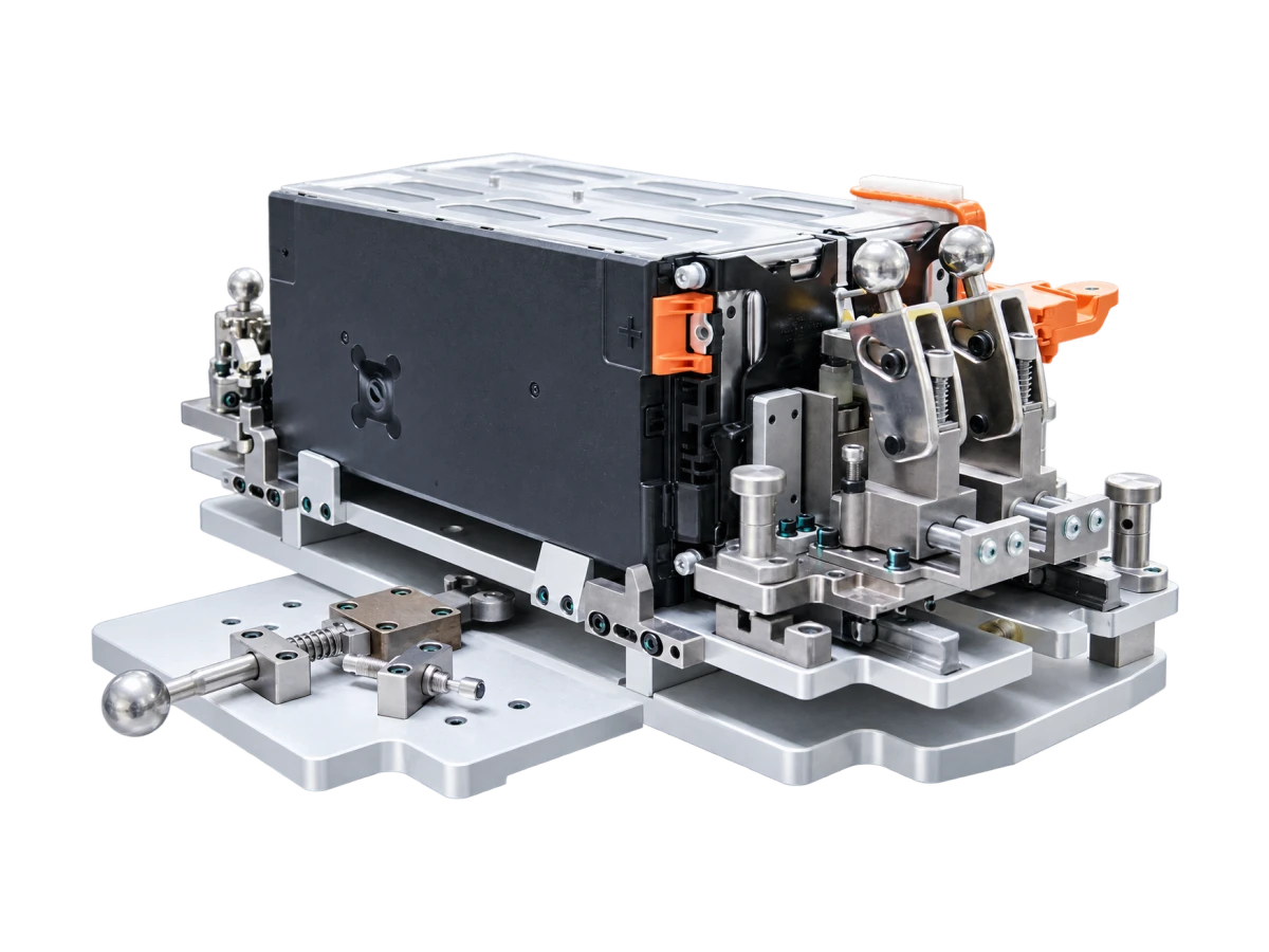Battery module and housing held in an assembly fixture with mounting and locating interfaces